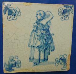 Schaatster met schaatsen aan de arm