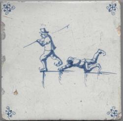 Twee schaatsers, één gevallen