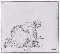 Een vrouw bindt haar schaatsen onder