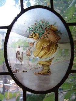 Medaillon met 'Kerstman op schaatsen' (glas in lood)