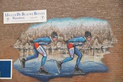 Muurschildering schaatsers